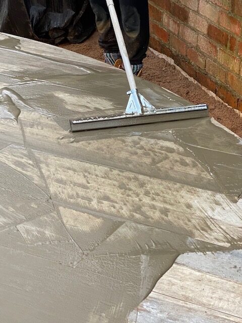 Applying Flowpoint with squeegee