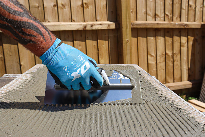 Applying EasyPrime to underside of patio slab