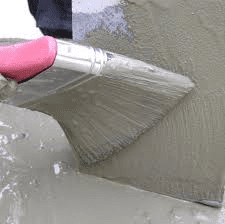 Applying primer to paving